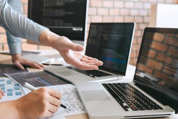 High-tech computer coding workspace for website development at Sydney Web Experts.