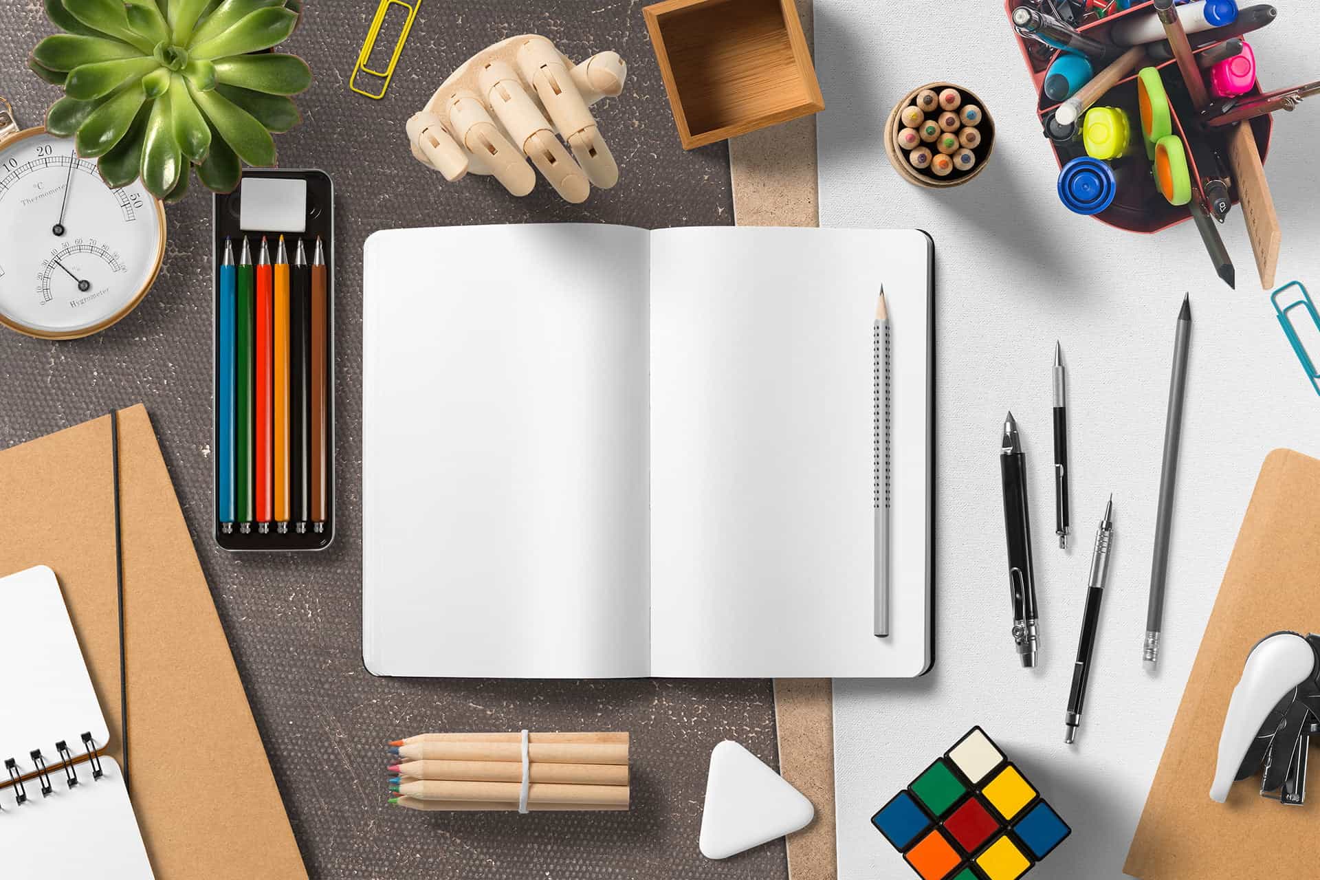 Colorful stationery and office supplies on a workspace for creative and professional design projects.